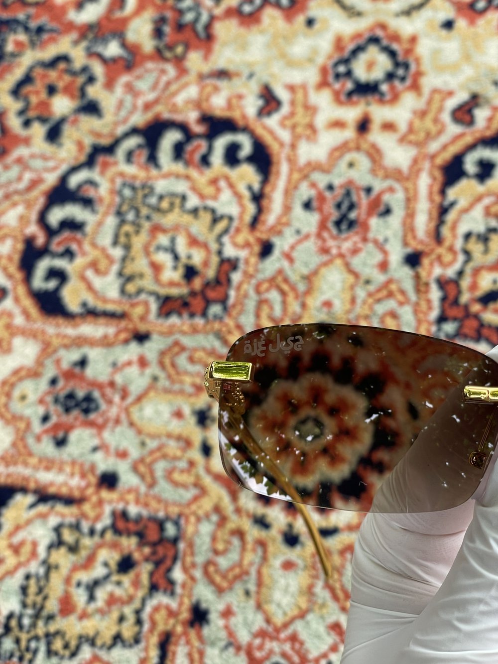 brown "abu diktator" sunglasses