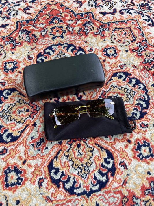 brown "abu diktator" sunglasses